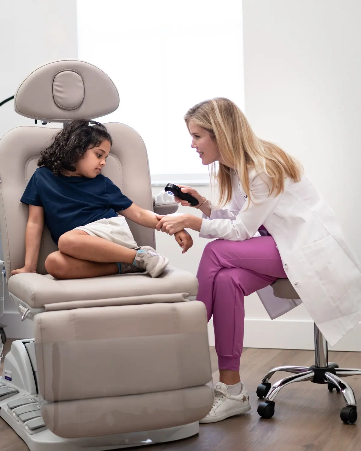Dr. Alexandra Grob examining a young patient